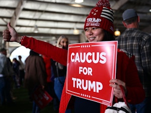 caption: Supporters of former President Donald Trump arrive to hear him speak at a commit to caucus rally in Las Vegas on Saturday. The Nevada Republican Party is holding a caucus to determine who wins the state's GOP delegates — a contest that's two days after the state-run primary.