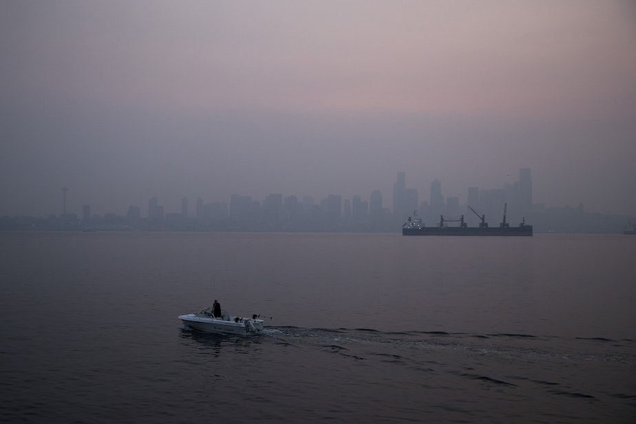 caption: The sun rises over Seattle as a massive plume of smoke from wildfires burning in California and Oregon made it's way into the area, on Friday, September 11, 2020, in Seattle. 