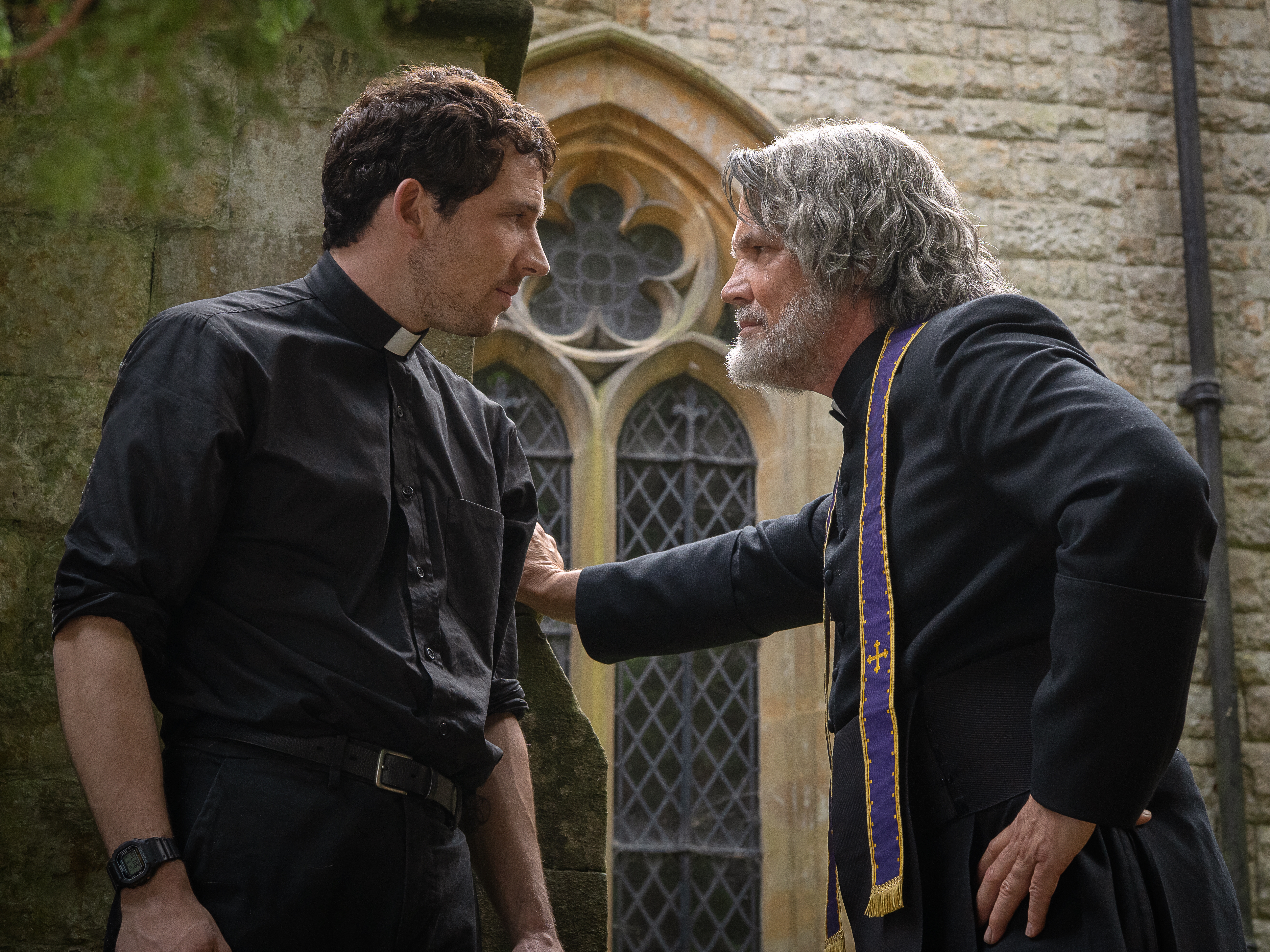 caption: Josh O'Connor and Josh Brolin in <em>Wake Up Dead Man: A Knives Out Mystery.</em>