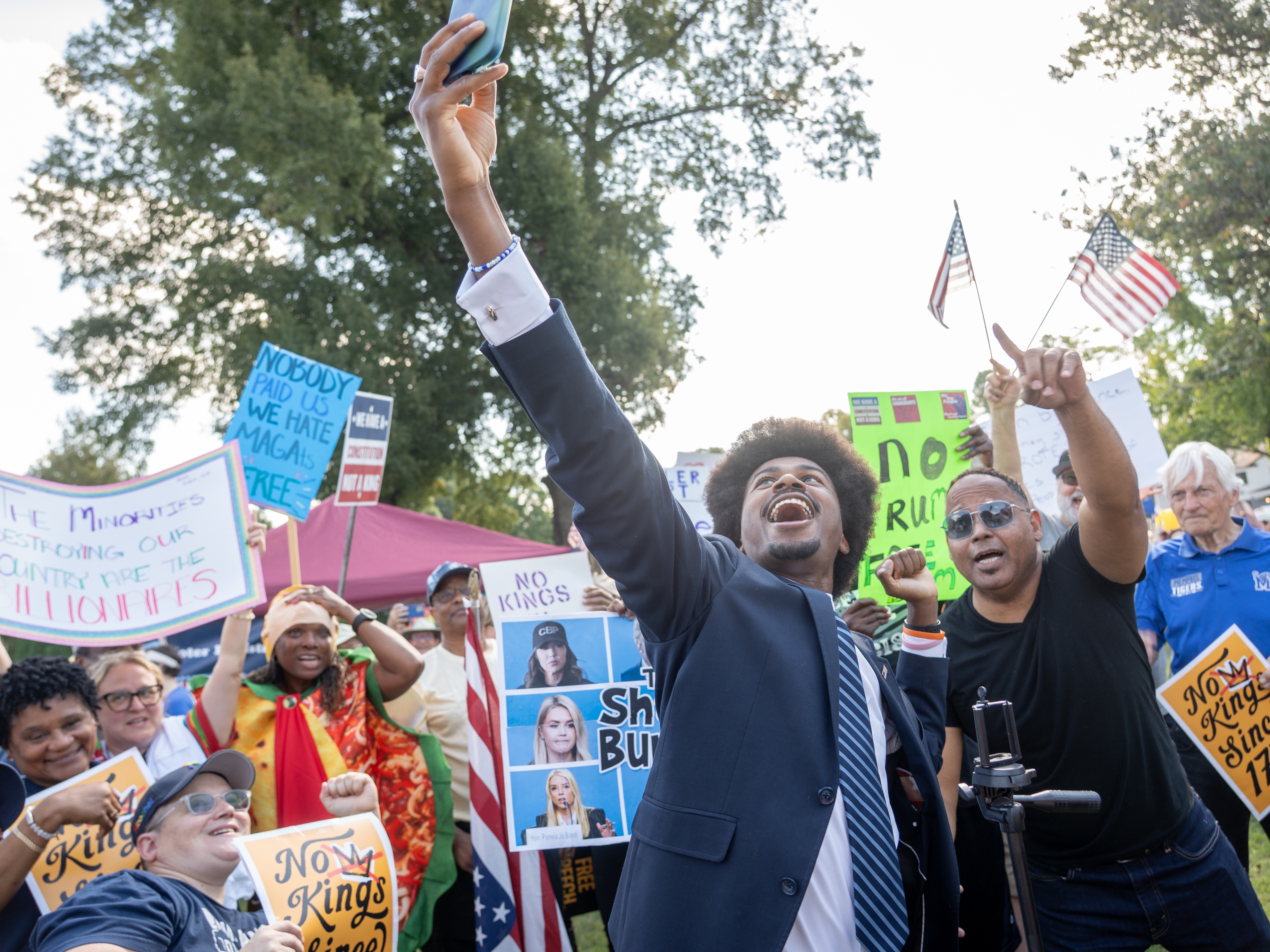 caption: Tennessee State Representative Justin Pearson takes a selfie with protesters at a "No Kings" protest on October 18, 2025 in Memphis, Tenn.  Pearson is looking to unseat his former boss, Rep. Steve Cohen.