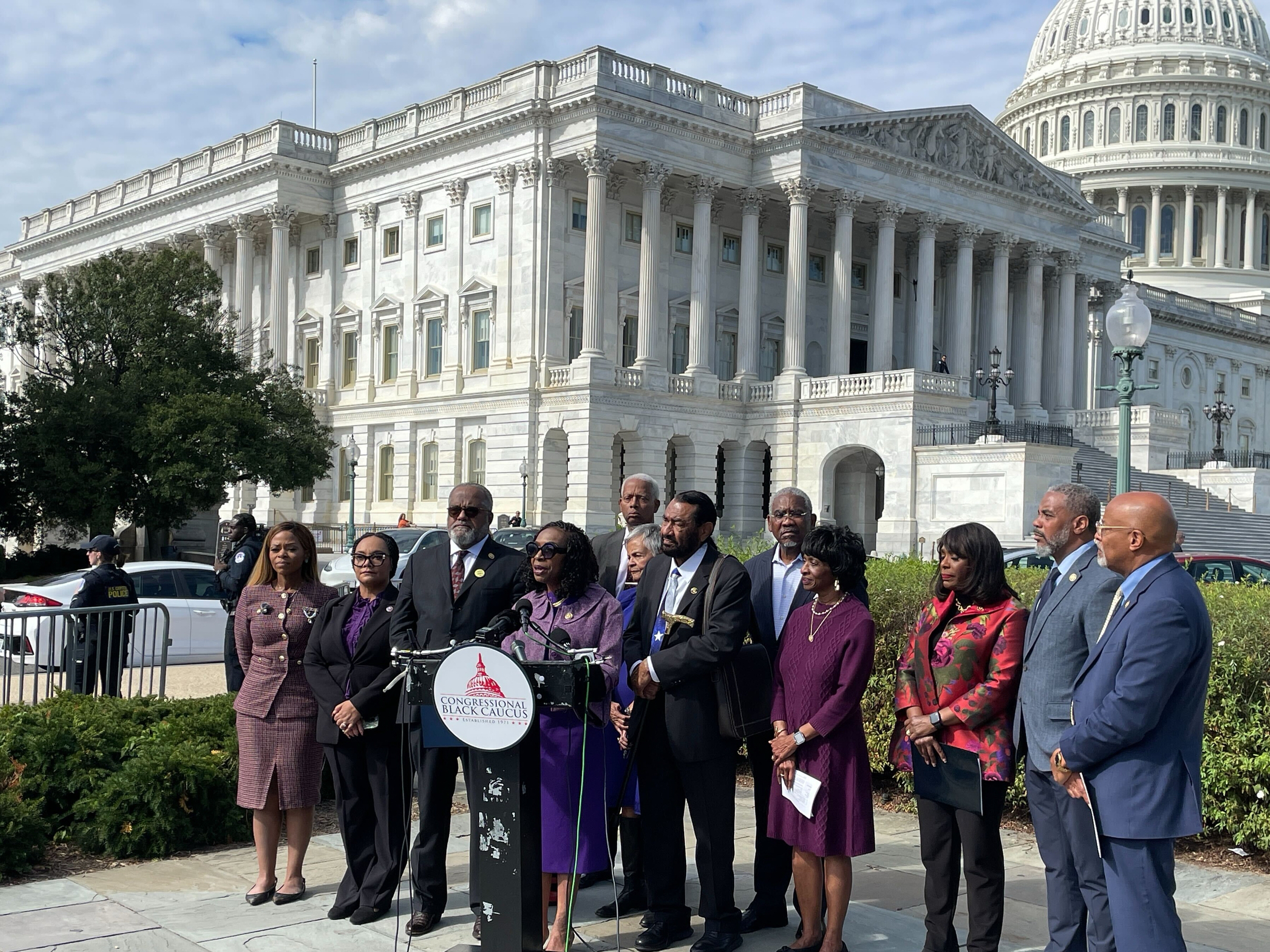 caption: Members of the Congressional Black Caucus speak outside the U.S. Capitol in October after the Supreme Court heard arguments about the Voting Rights Act.