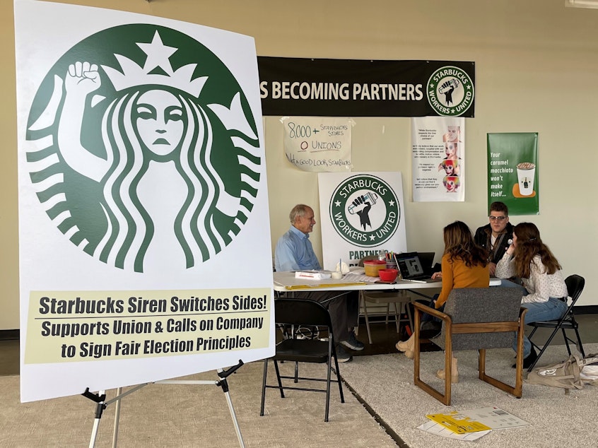 caption: Starbucks workers and organizers in Buffalo, N.Y., discuss efforts to unionize three local stores on Oct. 28.