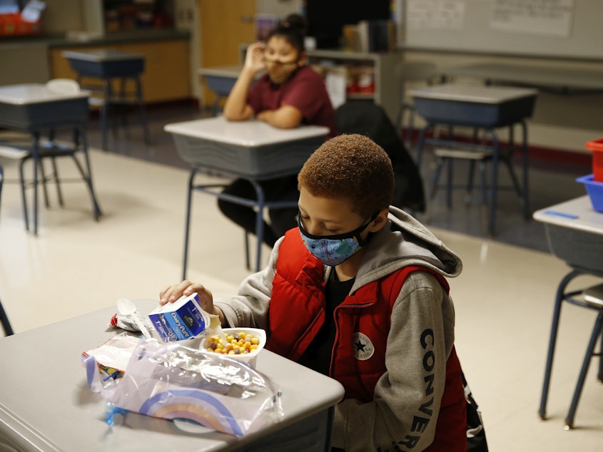caption: A fourth-grader eats breakfast at Mary L. Fonseca Elementary School in Fall River, Mass.