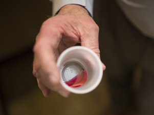 caption: A 35-mg liquid dose of methadone is shown here in March 2017 at a clinic in Rossville, Georgia. Guidelines from the Justice Department's Office of Justice Programs recommend that jails provide access to methadone and buprenorphine, which are considered front-line treatments for opioid withdrawal.