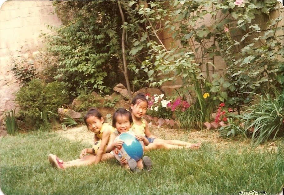 caption: Tae-Hyang and Nam-Sook Yu's three daughters as children in South Korea in the late 1970s. Hayden’s mom, Jihyun Andersen, is on the far right.