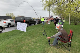 caption: Demonstrators in Spokane's Franklin Park April 22 said they wanted to fish, saying it's one of the most socially distant and isolating activities possible.