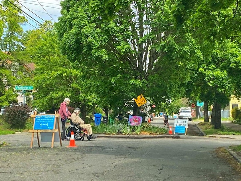 caption: A street is closed off to cars for pedestrian use during the 2020 Covid-19 pandemic in Seattle. 
