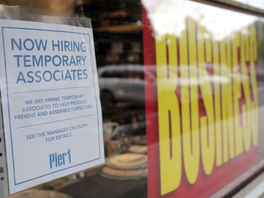 caption: A sign advertises hiring of temporary workers at a Pier 1 store that's going out of business in Coral Gables, Fla. Last week, initial unemployment claims broke a 20-week streak of being above 1 million.