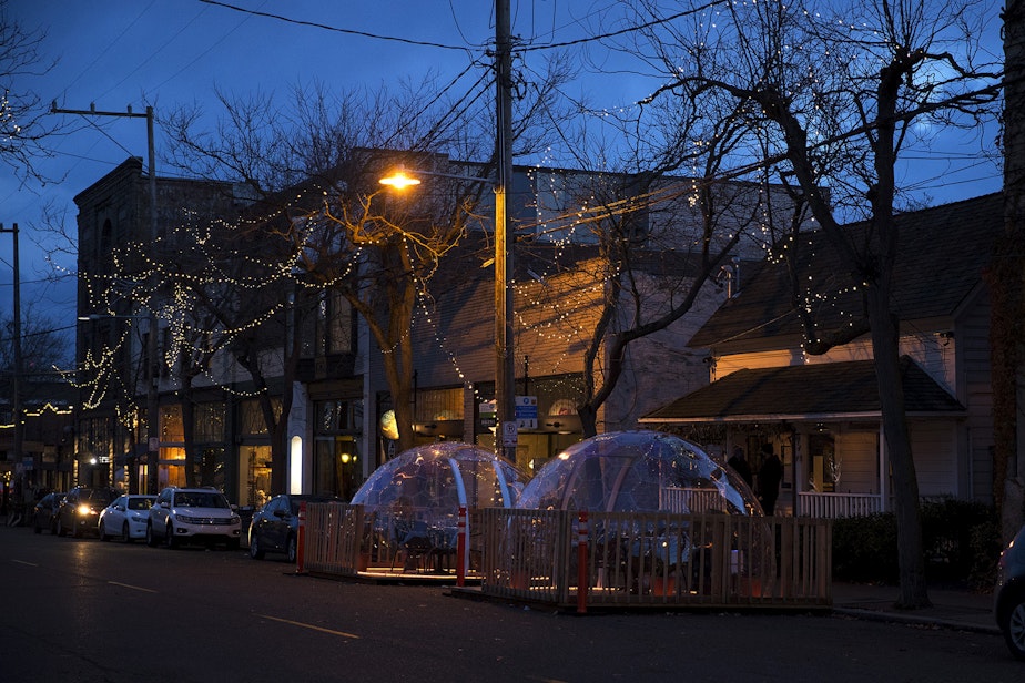 caption: Two clear dome structures for customers to dine in are shown outside of San Fermo on Sunday, November 15, 2020, along Ballard Avenue Northwest in Seattle.