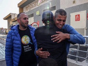 caption: Relatives and friends mourn the death of Saifeddin Issam Ayad Abutaha, a member of the U.S.-based aid group World Central Kitchen who was killed as Israeli strikes hit its convoy delivering food in Gaza, during his funeral in Rafah, in the southern Gaza Strip, on Tuesday.