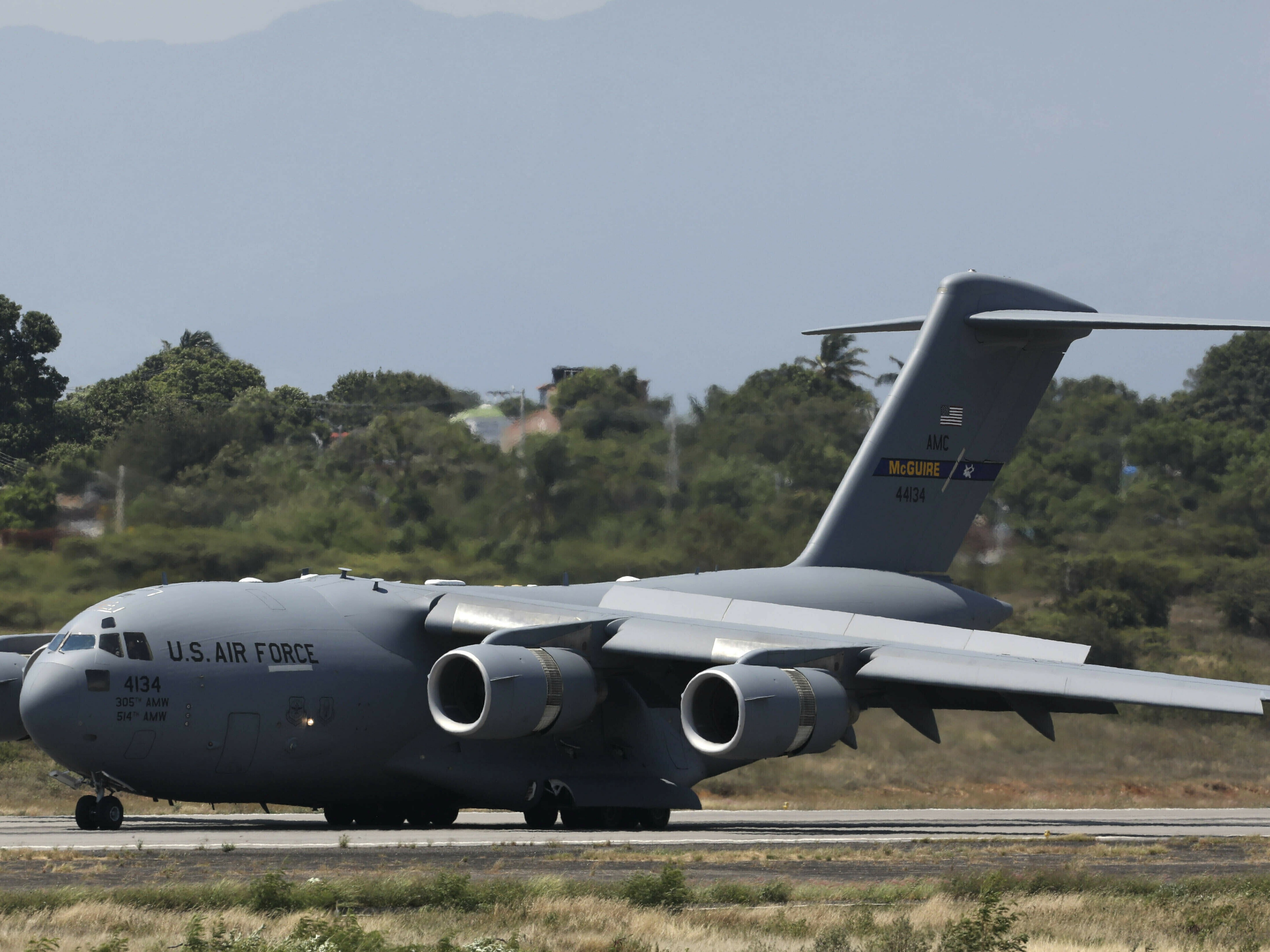 caption: A United States Air Force C-17 cargo plane loaded with humanitarian aid lands at Camilo Daza airport in Cucuta, Colombia, on Feb. 16, 2019.