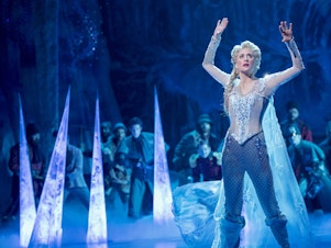 caption: Caissie Levy performs as Elsa in the stage adaptation of <em>Frozen</em>, which opened on Broadway in 2018.