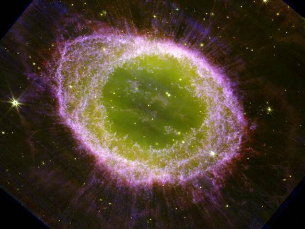 caption: The famous Ring Nebula is seen in brilliant new clarity, thanks to a new James Webb Space Telescope image released by researchers in the JWST Ring Nebula Imaging Project.