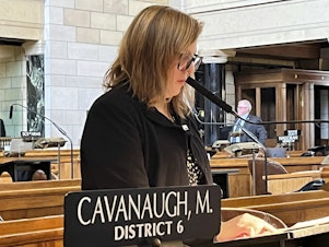 caption: State Sen. Machaela Cavanaugh speaks before the Nebraska Legislature in March as part of an effort to filibuster every bill that comes before the legislature this session.