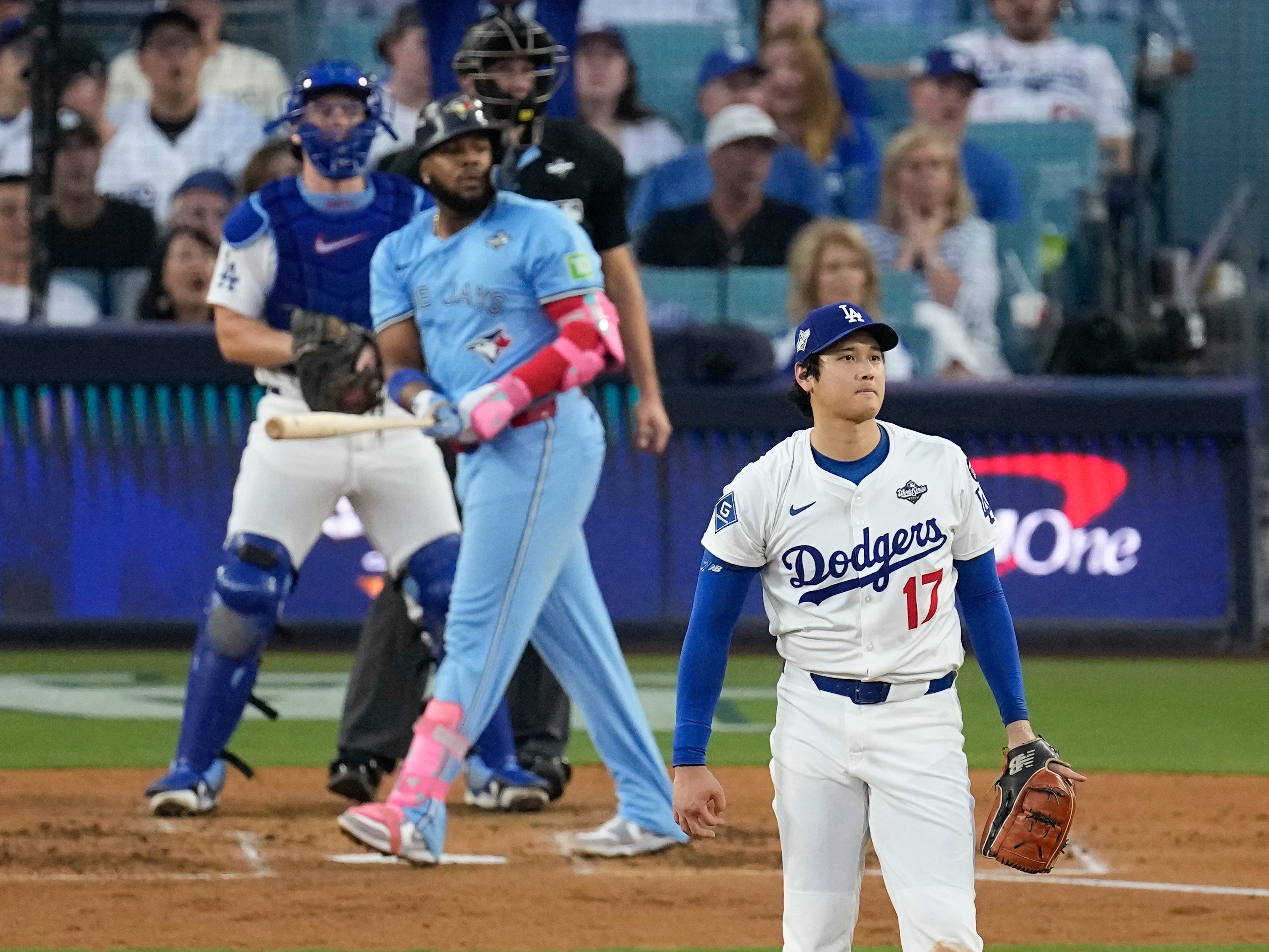 caption: Los Angeles Dodgers pitcher Shohei Ohtani (17) watches Toronto Blue Jays' Vladimir Guerrero Jr's two run home take flight during the third inning in Game 4 of baseball's World Series, on Tuesday in Los Angeles.