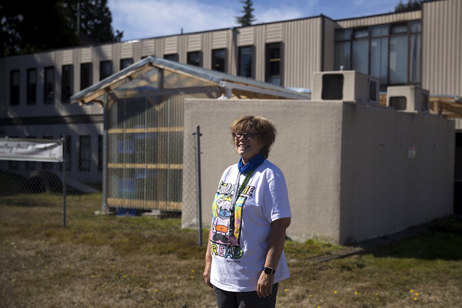 caption: Pastor Jan Bolerjack stands for a portrait on Tuesday, September 22, 2020, at the Tukwila Pantry Food Bank on South 140th Street in Tukwila.