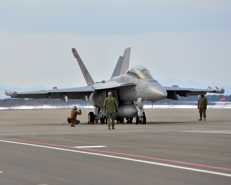 caption: Sailors and Pilots Prepare to Launch an EA-18G Growler.