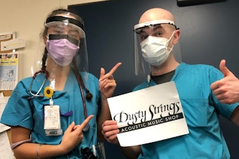 caption: Health workers sporting Dusty Strings-designed and manufactured PPE.
