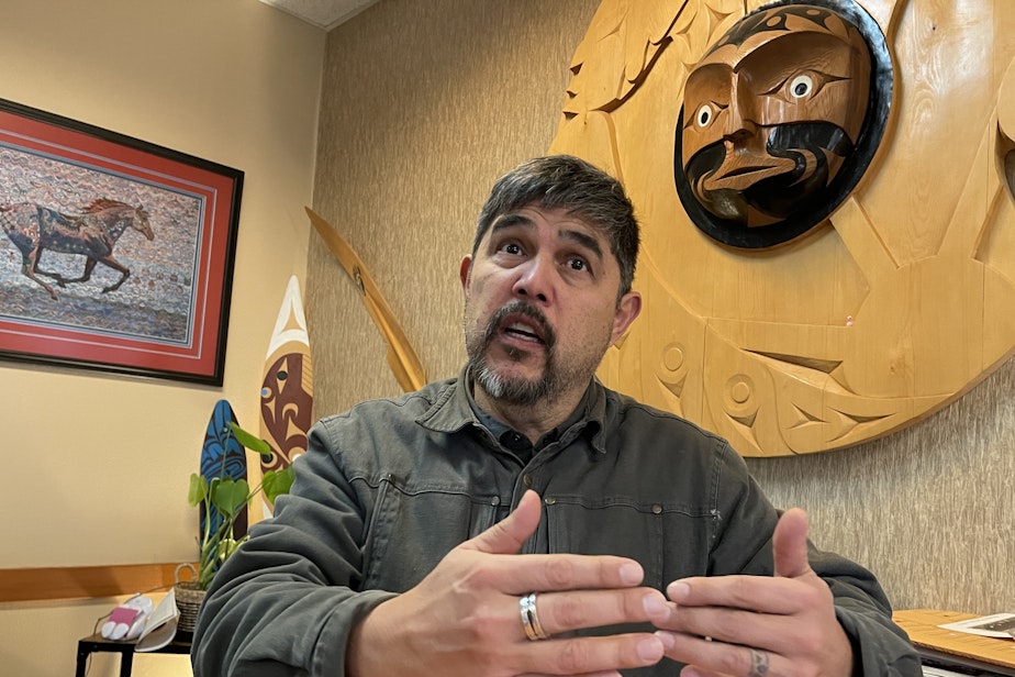 caption: Quinault Indian Nation President Guy Capoeman sits in his office in Taholah, Washington, on Jan. 12.