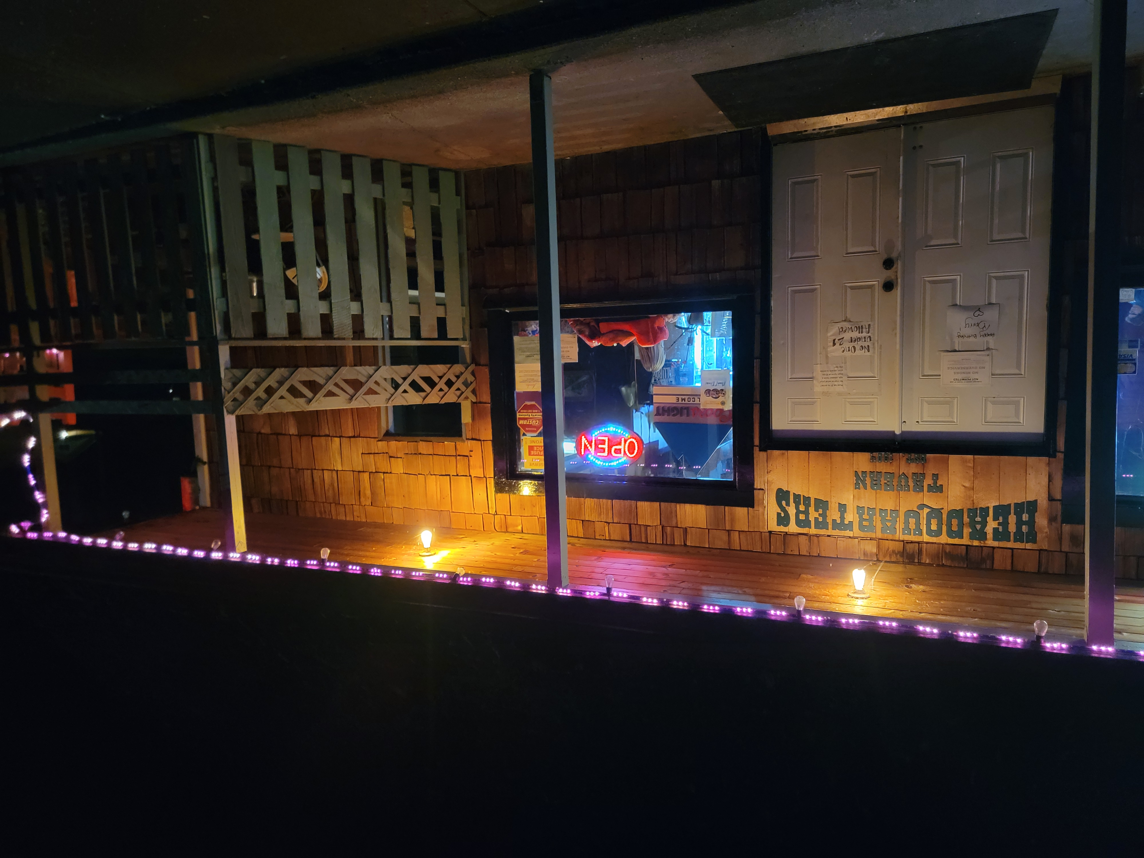 caption: Headquarters Tavern is part bar/ part community center on Thursday, November 13, 2025.