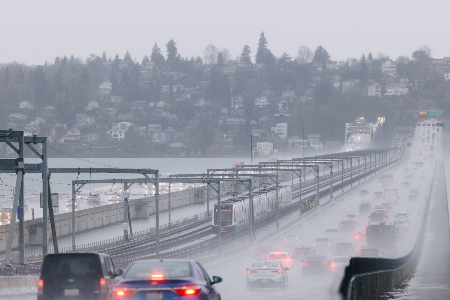 caption: A Crosslake Connection train crosses I-90 linking Seattle and Bellevue during a practice run in December of 2025 (before the line opened to the public).