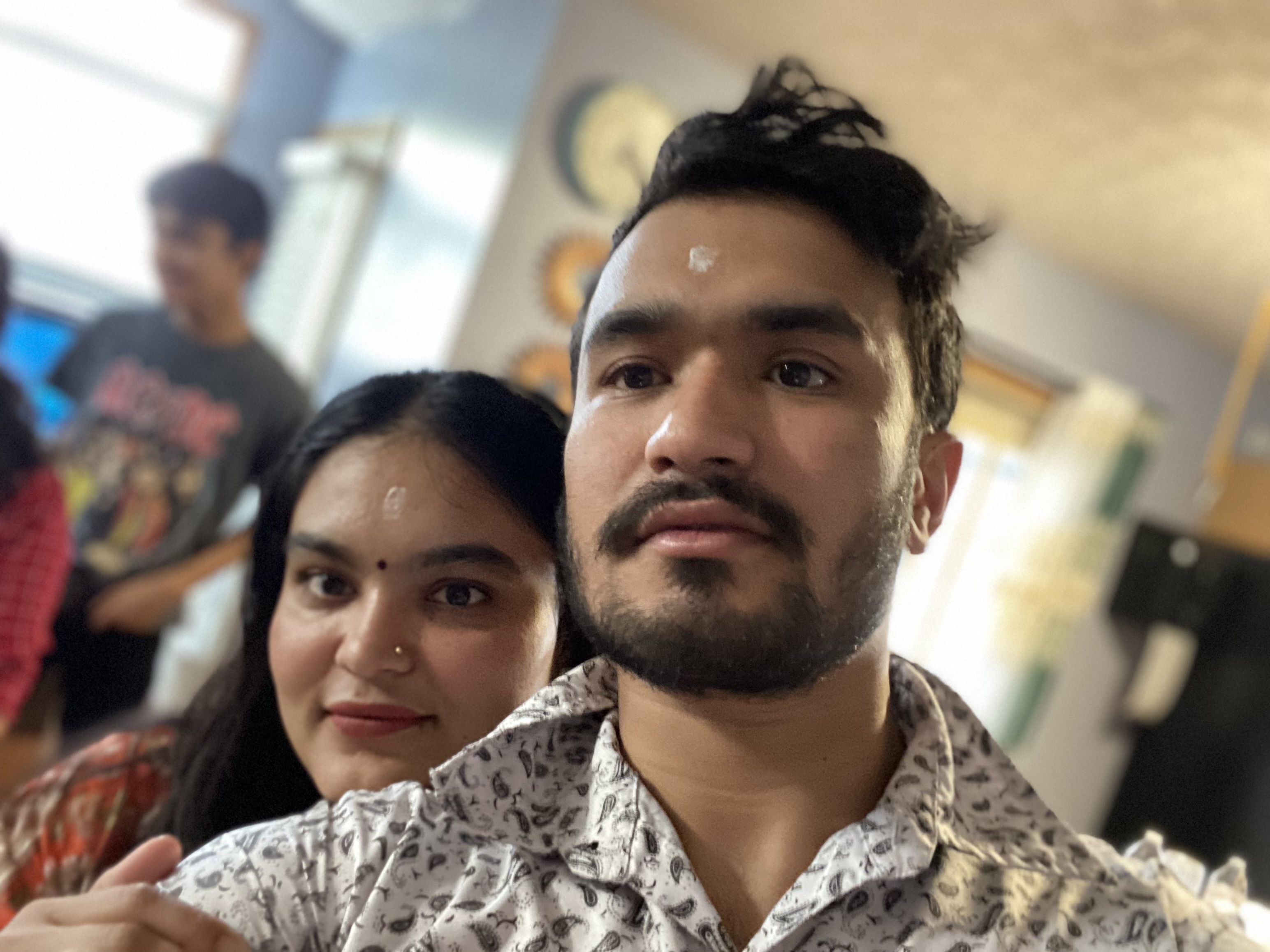 caption: Mohan Karki (R) and his wife Tika Basnet (L) pose for a photo before he was detained by immigration agents in April.