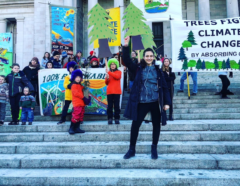 caption:  Jamie Margolin (foreground) and other young climate activists in Olympia on Monday
