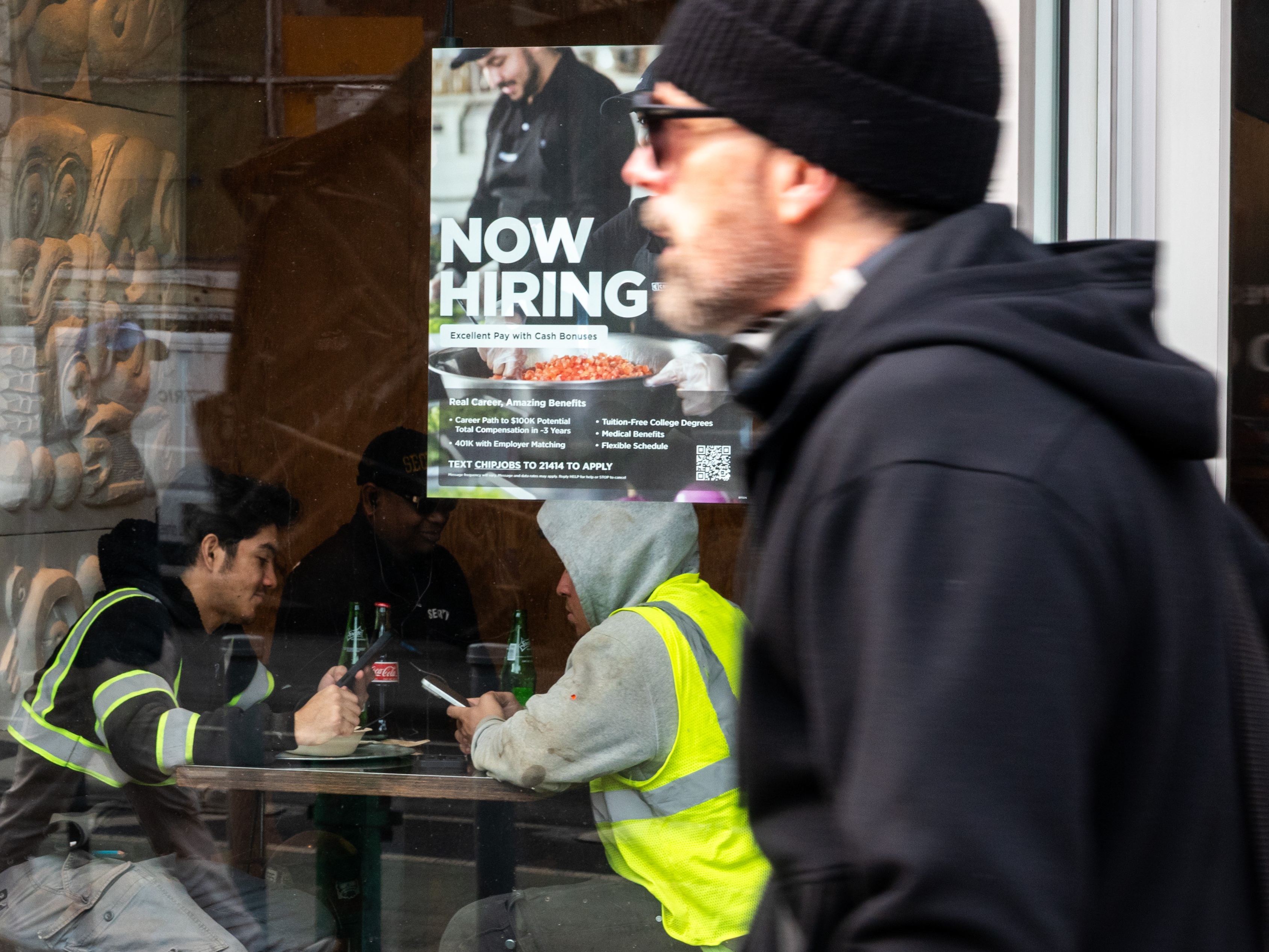 caption: The job market thawed somewhat last month as U.S. employers added 130,000 jobs. The unemployment rate dipped to 4.3%.