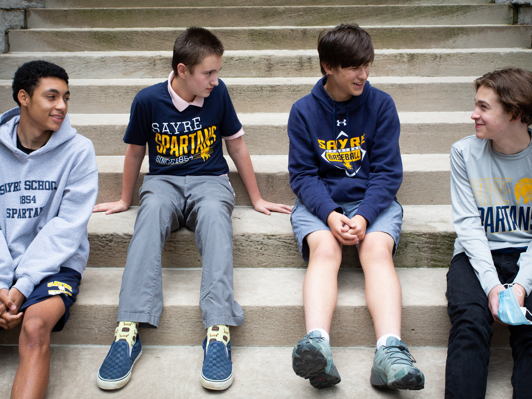 caption: Eighth-graders Braeden Collett (left), Bo Porter, Brennan Williams and Dominique Jannat explored the "various things that get done behind the scenes" to make their campus run smoothly in their winning podcast "Whodunnit?"