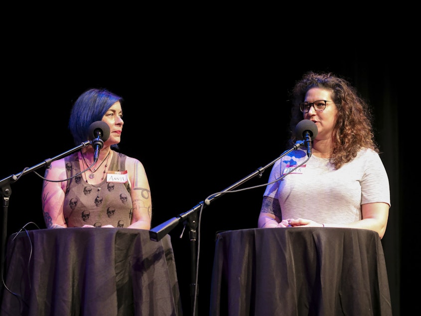 caption: Contestants Annie O'Reilly and Tyler Parthemer compete in trivia games on <em>Ask Me Another</em> at the Balboa Theatre in San Diego, Californi