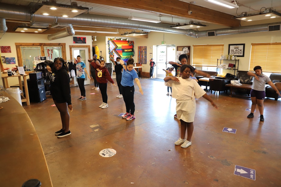 caption: Mikayla Weary (front) leads the step team at Black Coffee Northwest. 
