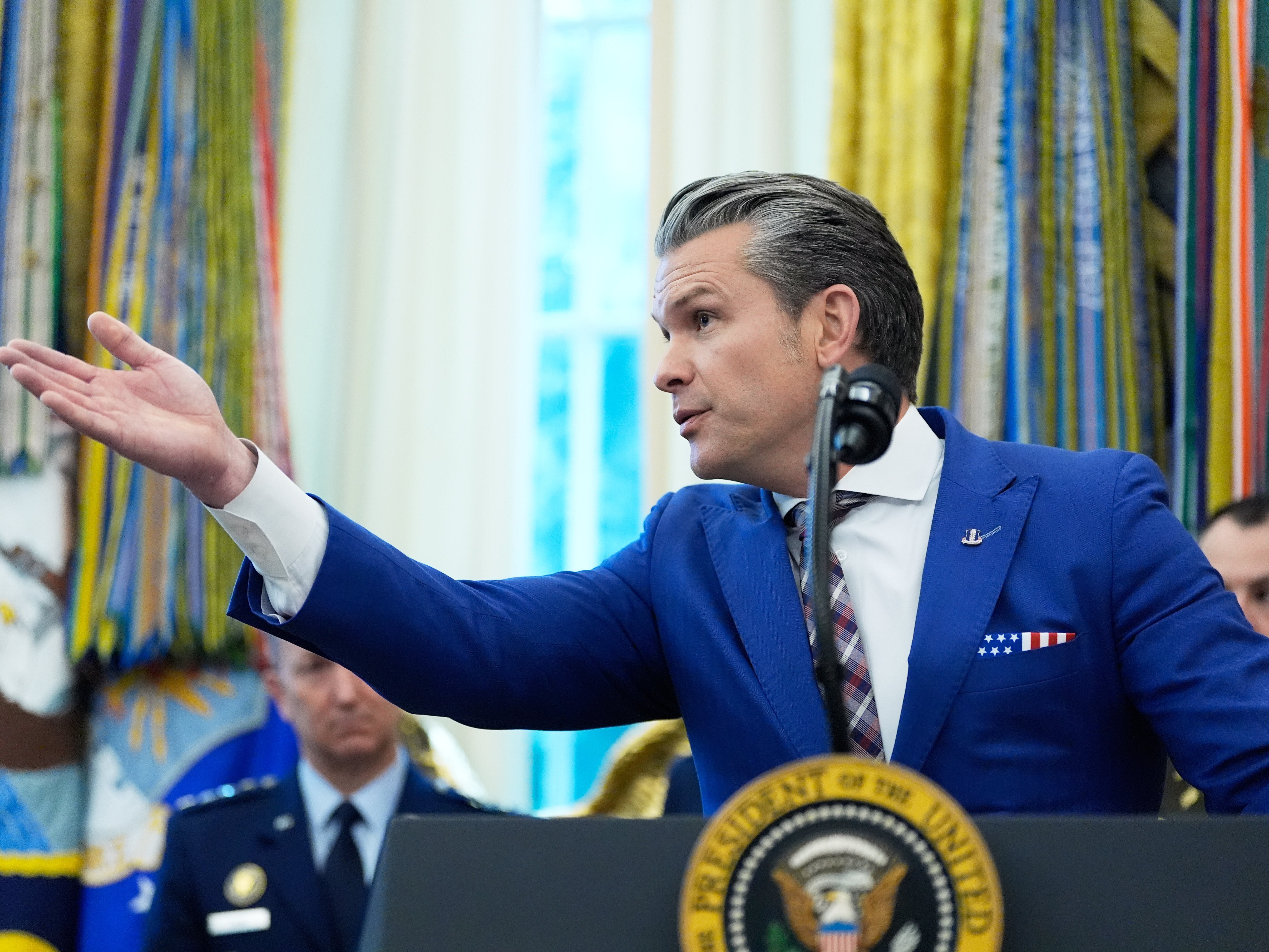 caption: Defense Secretary Pete Hegseth speaks during a Mexican Border Defense Medal presentation in the Oval Office of the White House, Monday, Dec. 15, 2025, in Washington.