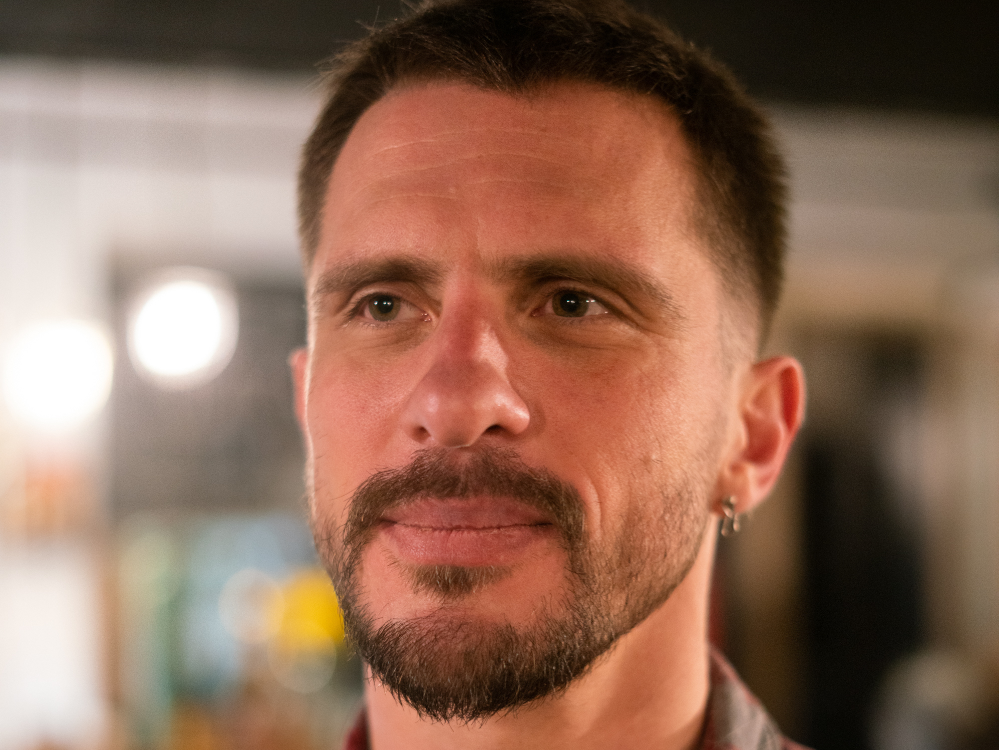 caption: Lev Kalashnikov, 35, is a tech entrepreneur who's created Telegram groups to help other Russians get settled in Tbilisi.