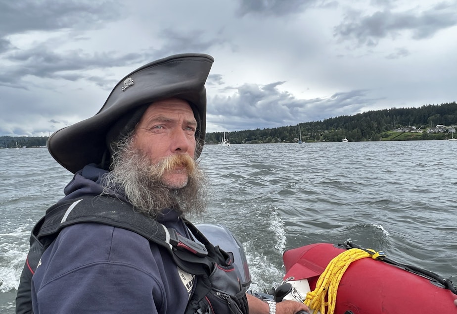 caption: Sir Thomas Gregory, who some call the "Pirate King," helps teach new liveaboards the ropes of living full-time on a boat.