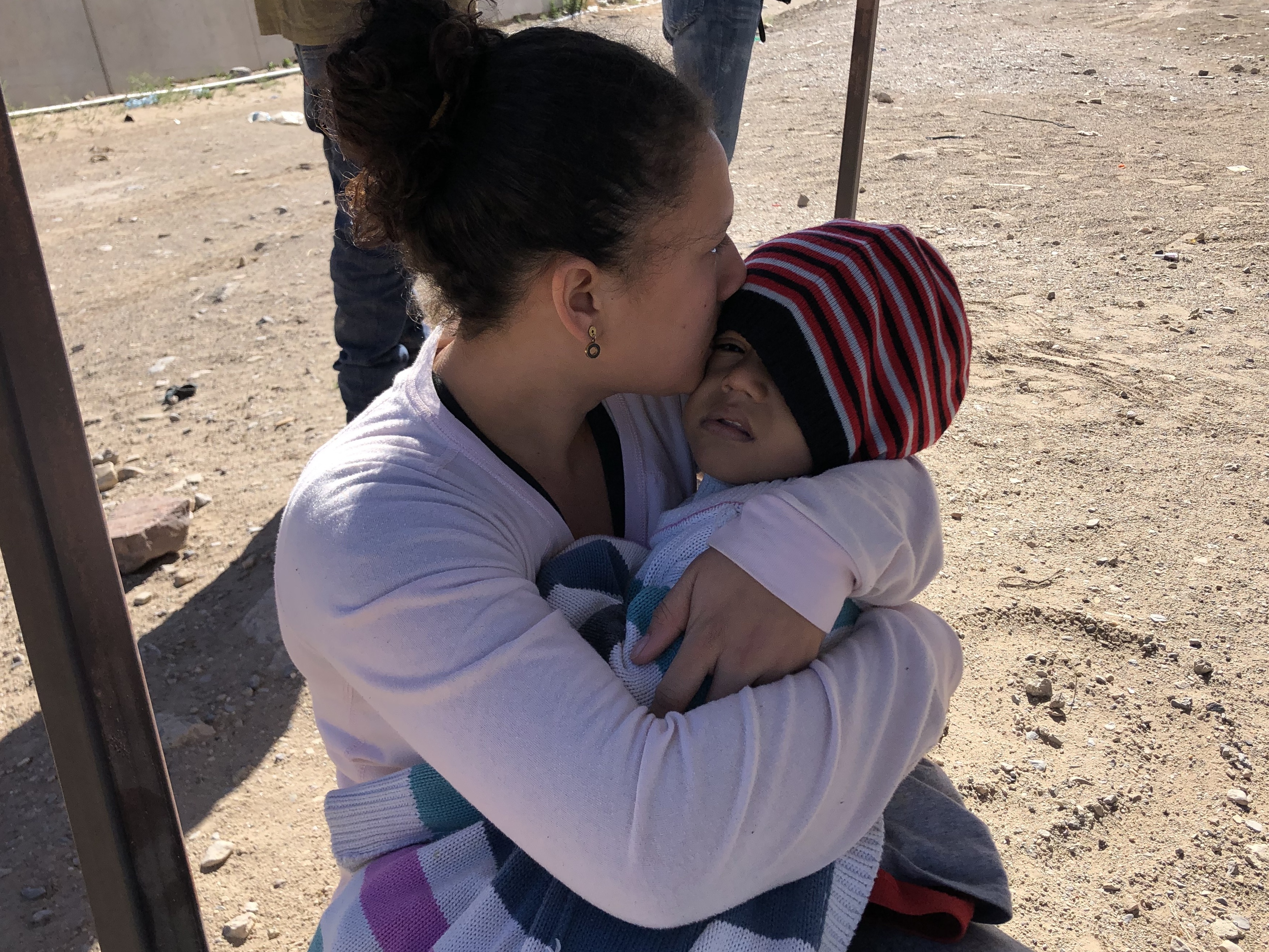 caption: Irsi Castillo of Honduras and her three year-old daughter just after crossing the Rio Grande into the U.S. in El Paso, Texas. Castillo is one of surge of thousands of migrants claiming asylum at the U.S.-Mexico border.