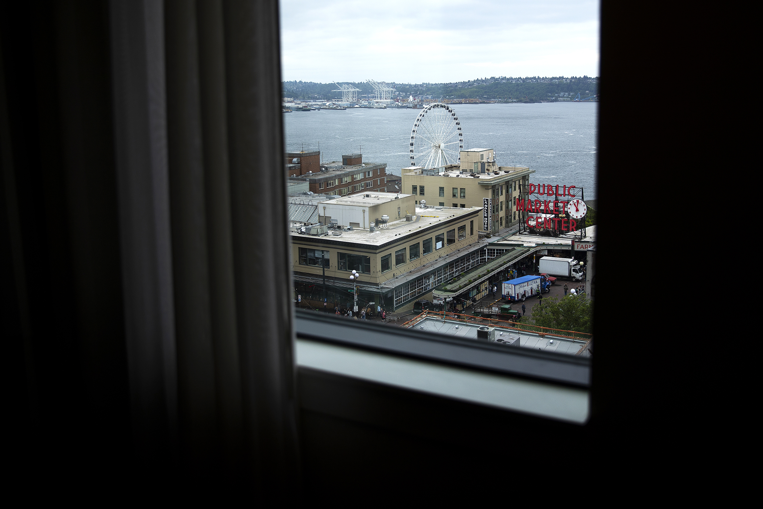 caption: The view from a room on the top floor of the State Hotel is shown overlooking Pike Place Market, on Friday, May 8, 2026, in Seattle. 
