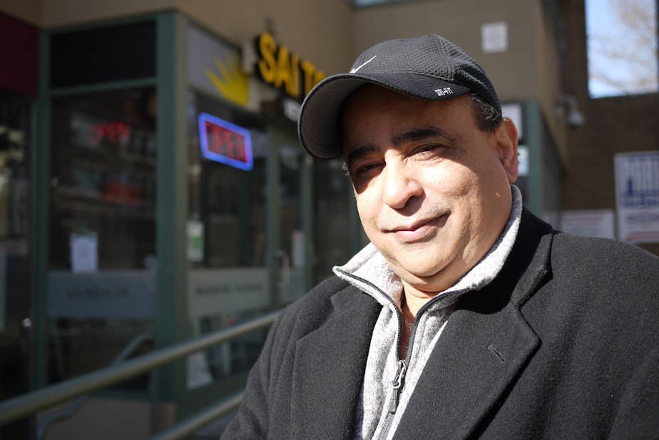 caption: Rizwan Samad, president New Wave Travel, outside his Seattle office.
