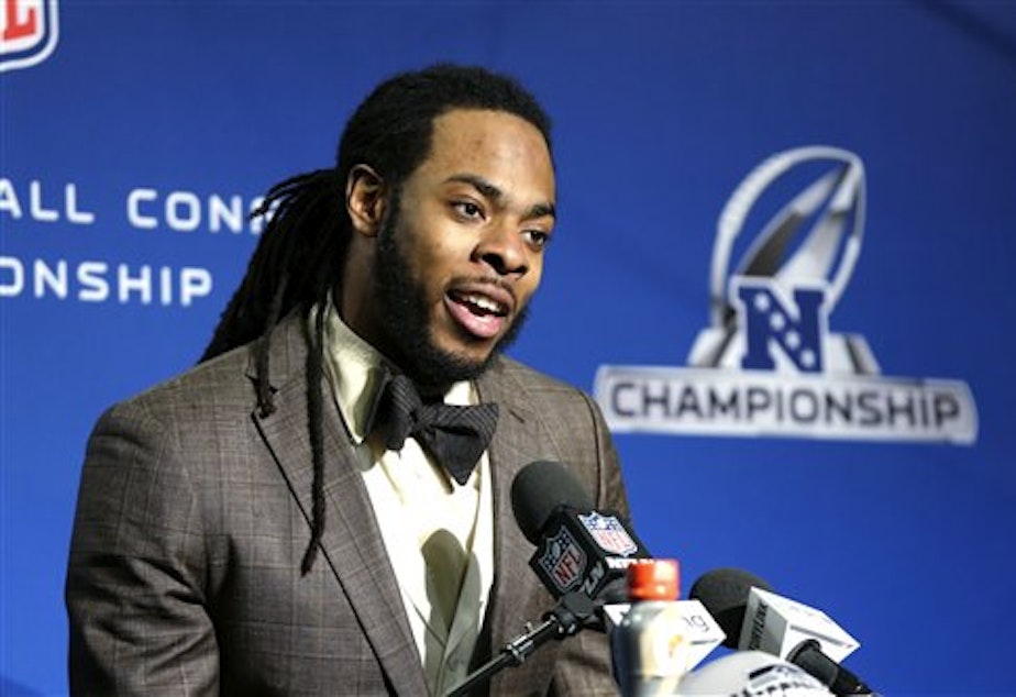 caption: Richard Sherman, Seattle Seahawks cornerback, speaks at a news conference after Seattle beat the San Francisco 49ers for the NFC Championship on Sunday.