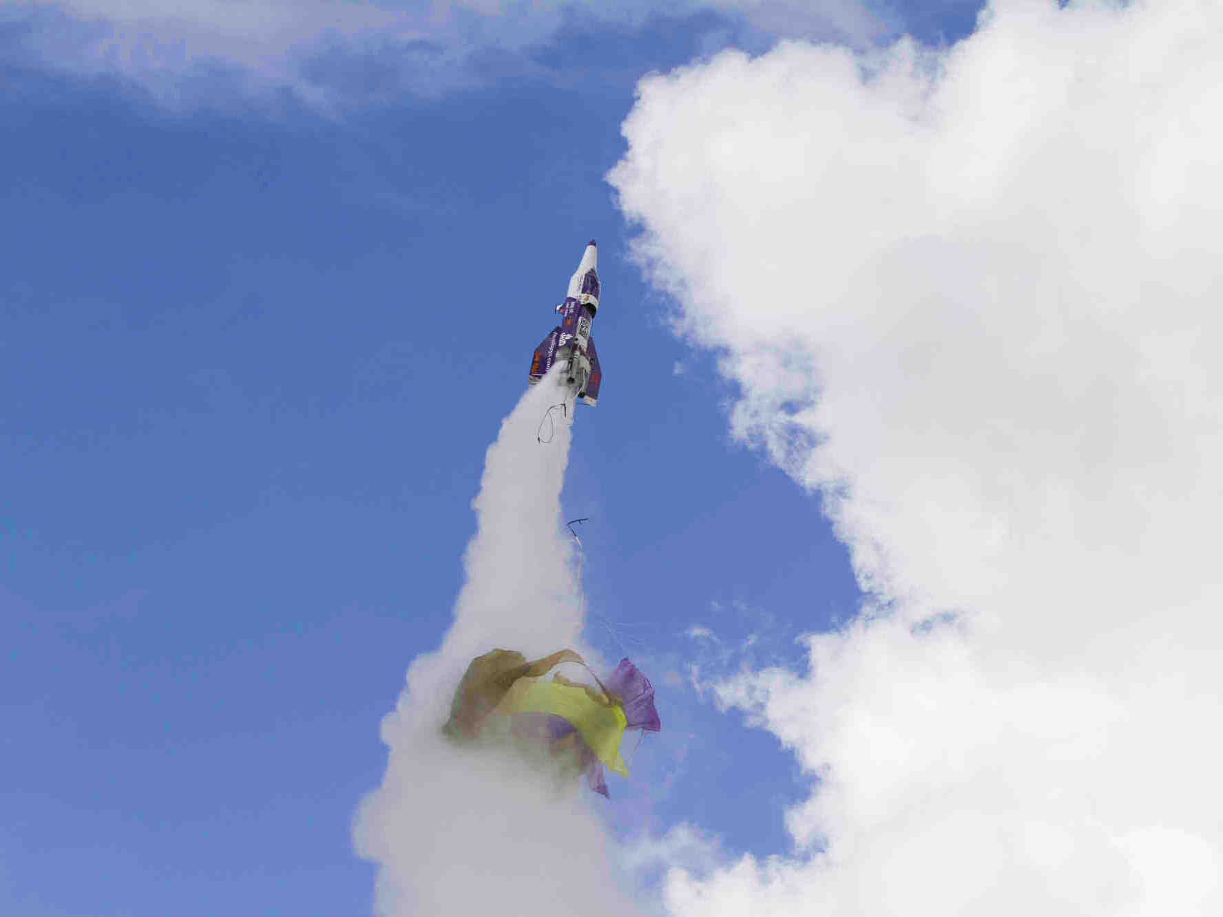 caption: "Mad" Mike Hughes' rocket takes off with what appears to be a parachute tearing off during its launch near Barstow, Calif. Hughes was killed when the rocket crashed Saturday.