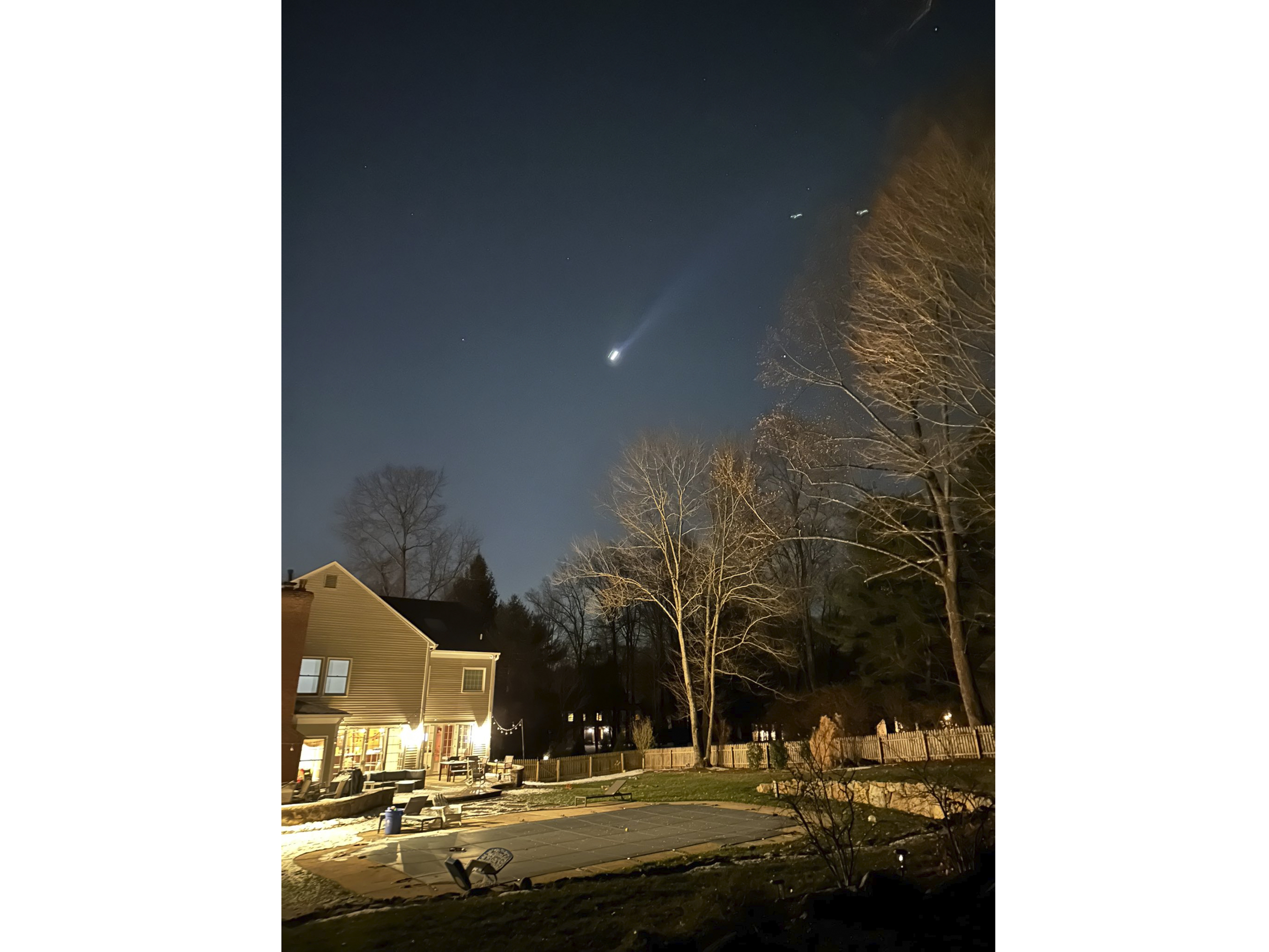 caption: Residents across New Jersey have been trying to decipher who has been flying mysterious drones over the state, with some taking to Facebook to share videos of sightings. Above, a screengrab from video of a potential sighting shared on Facebook.