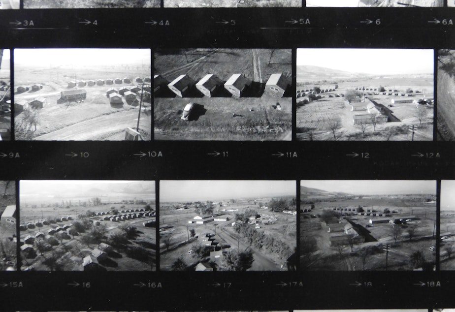 caption: These homes were originally an army camp, and were converted to house farm workers. Nash had to climb a water tower and run the Leica with one hand, while holding on to the ladder with the other, to get these aerial photographs. 