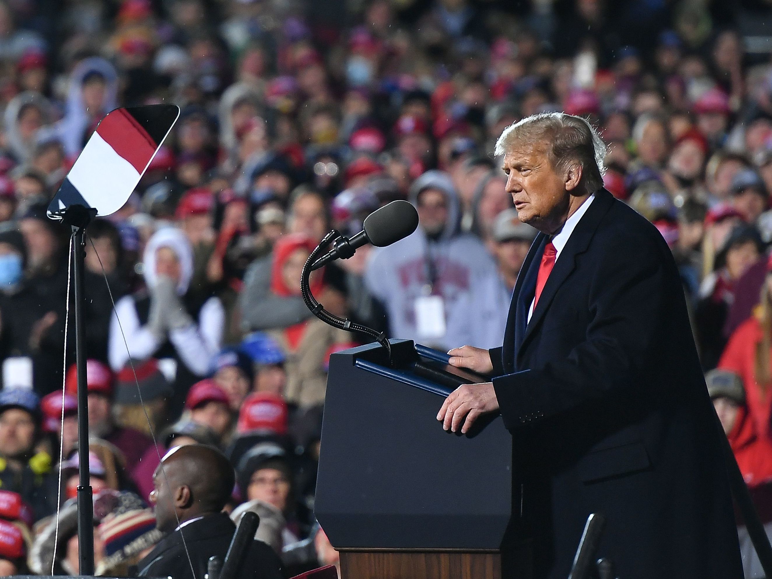 caption: President Trump holds a campaign rally at Duluth International Airport in Duluth, Minn., on Wednesday.