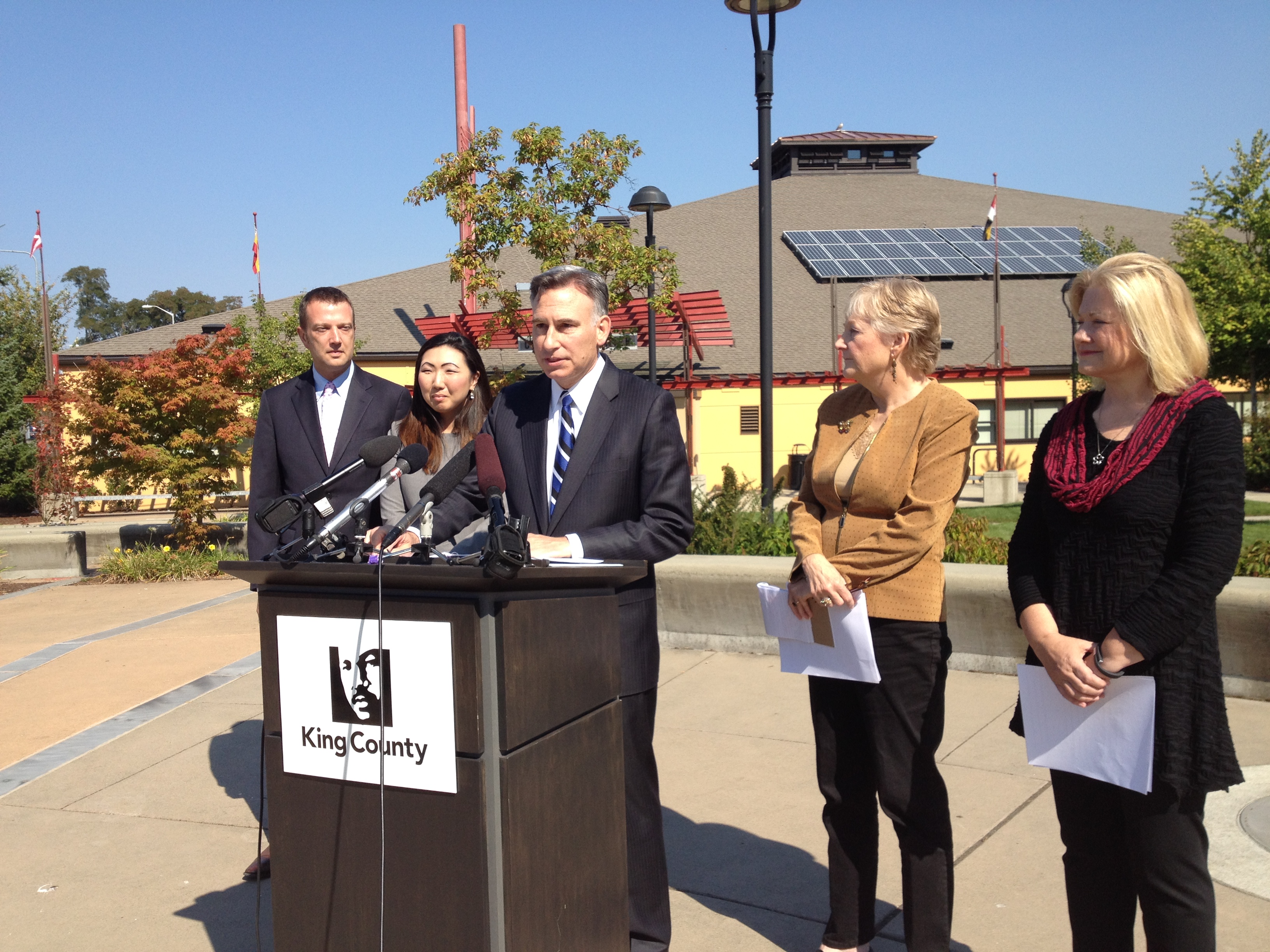 caption: King County Executive Dow Constantine (center) announced a new partnership with the City of Seattle and Planned Parenthood to save the Greenbridge clinic from closure. 