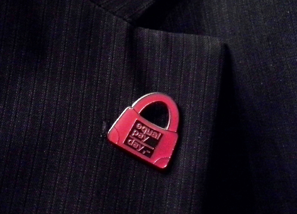 caption: Equal Pay Day pin