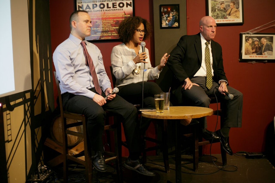 caption: Seattle Police Sgt. Sean Whitcomb, left, UW Professor Megan Ming Francis and Seattle Police Assistant Chief Robert Merner at Humanities Washington's Think & Drink. 