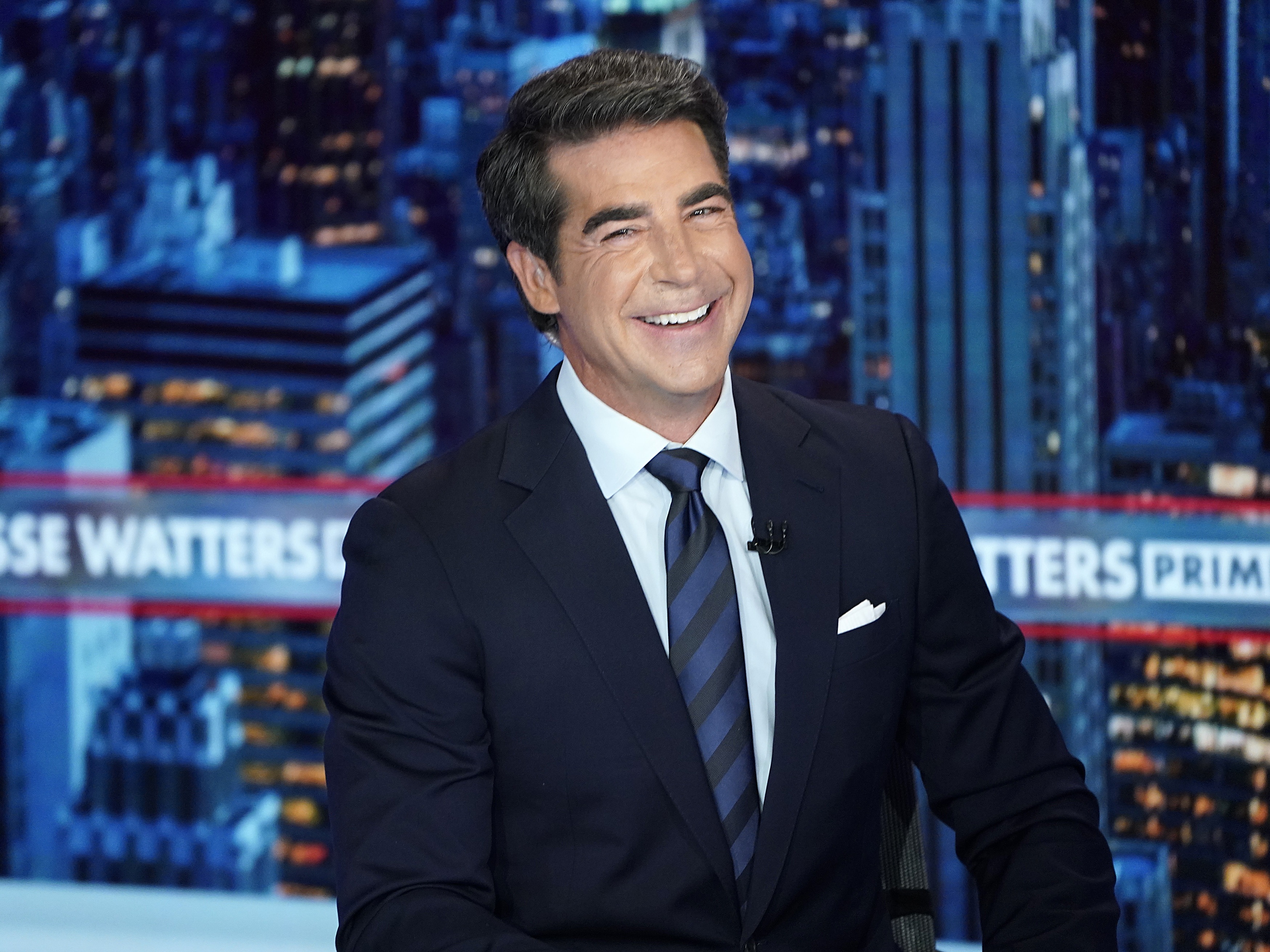 caption: Fox anchor Jesse Watters texted a colleague, "Think about how incredible our ratings would be if Fox went ALL in on STOP THE STEAL," according to legal filings. Watters later testified under oath he never found such claims credible.<br><br>