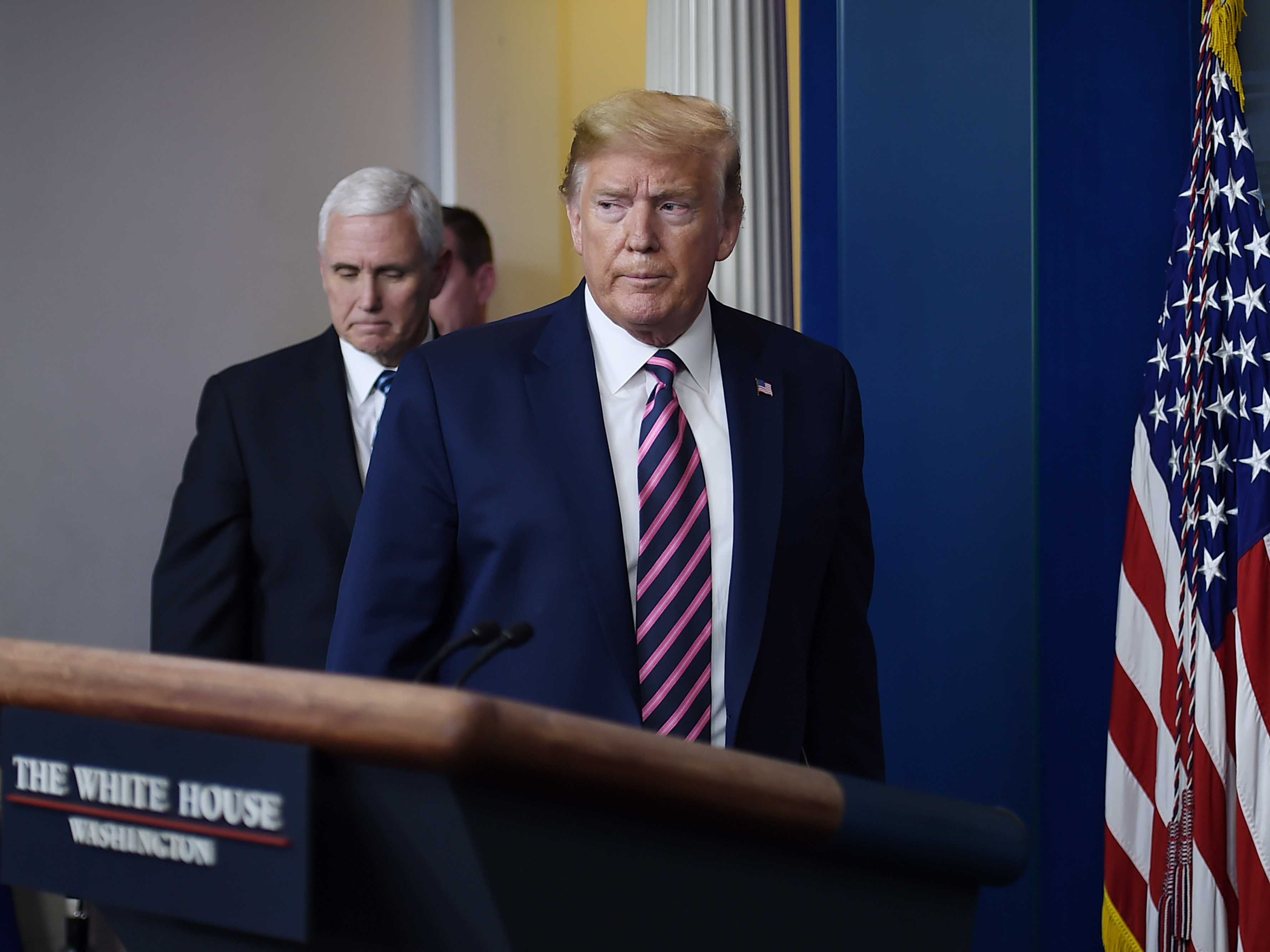 caption: President Trump is seen with Vice President Pence in the Brady Briefing Room of the White House on Friday.