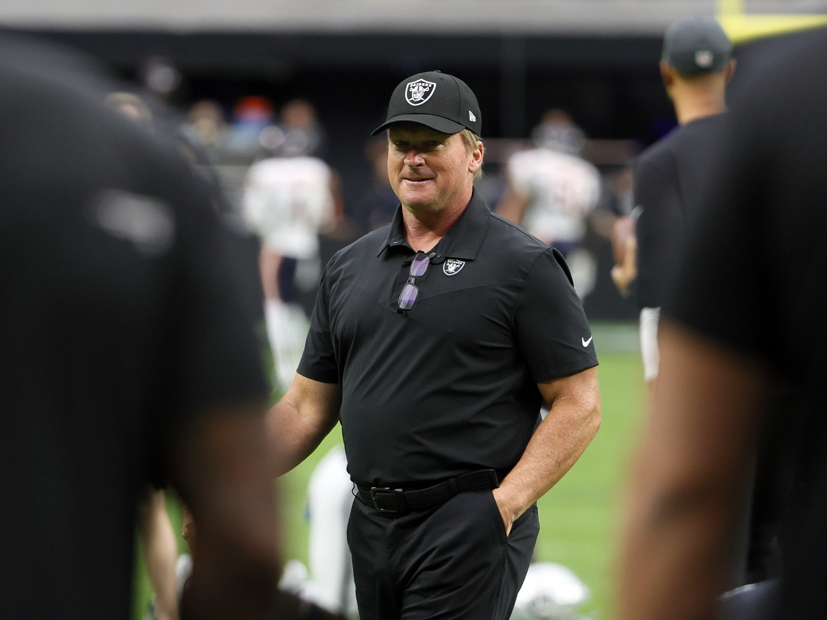 caption: Jon Gruden, pictured last October during his final game as head coach of the Las Vegas Raiders before his resignation over offensive emails he wrote as a broadcaster at ESPN.
