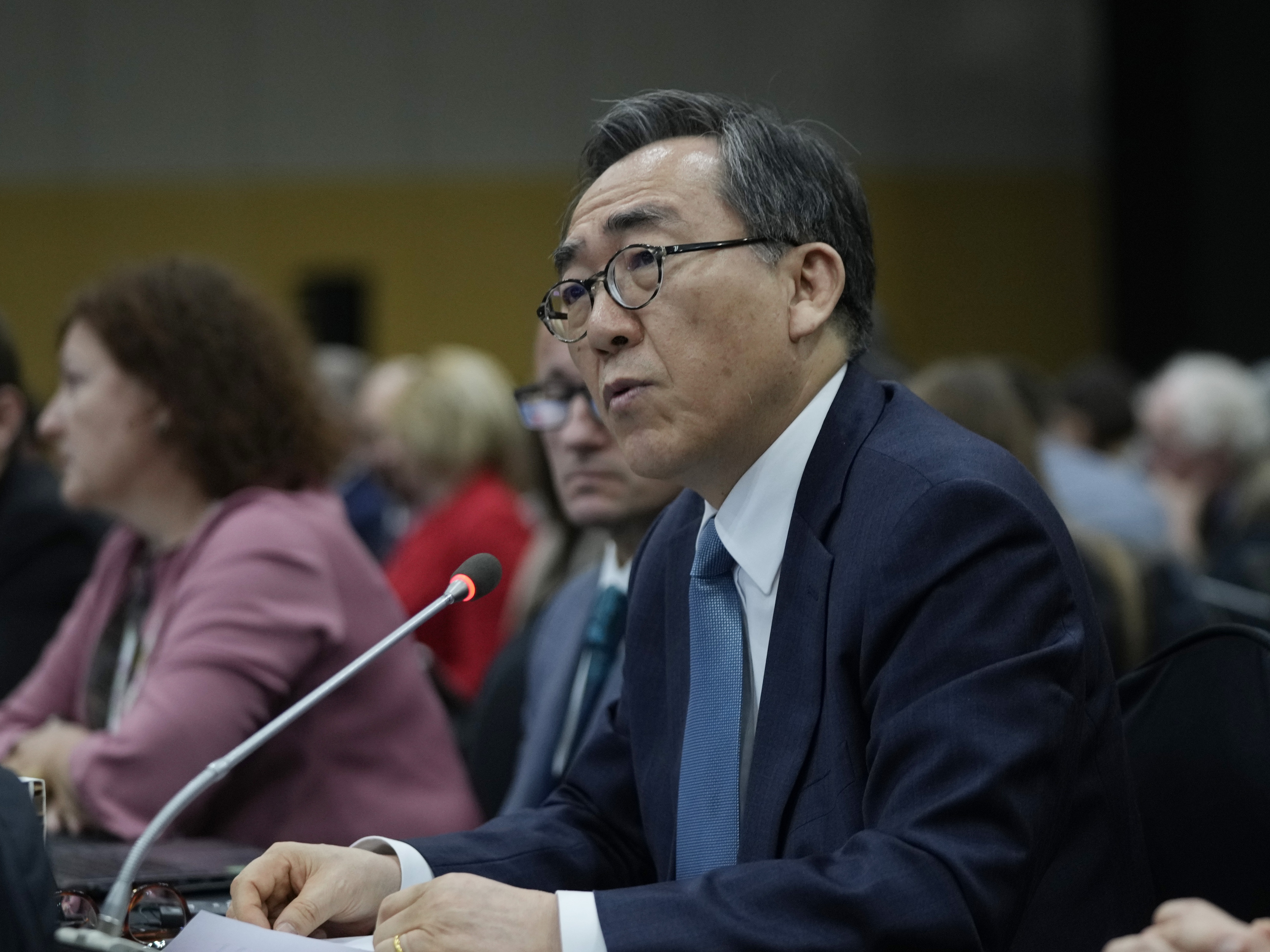 caption: South Korean Foreign Minister Cho Tae-yul speaks during a plenary of the fifth session of the Intergovernmental Negotiating Committee on Plastic Pollution in Busan, South Korea, Sunday, Dec. 1, 2024.