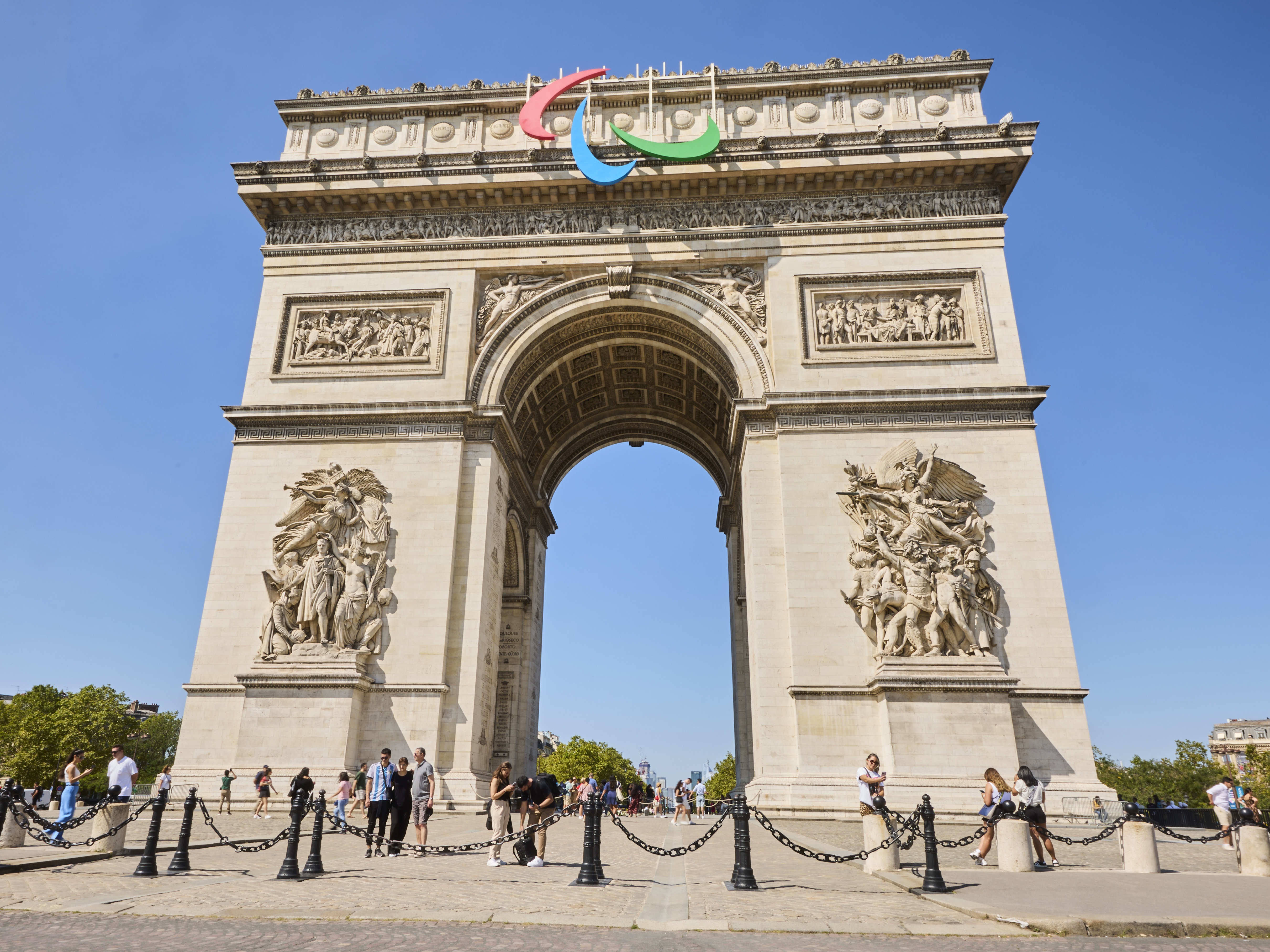 caption: The Arc de Triomphe in Paris stands ready for the 2024 Paralympic Games.